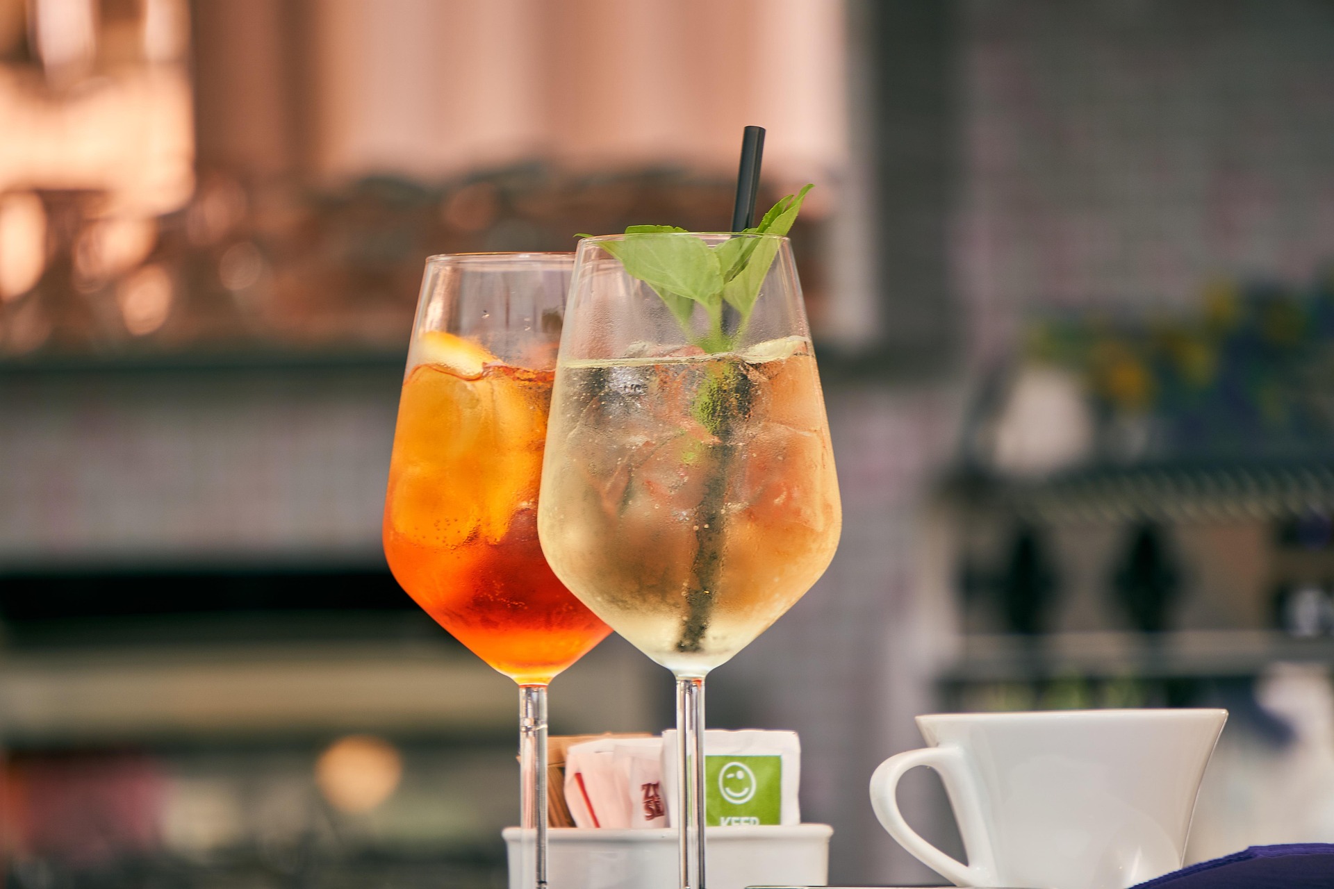 A refreshing Aperitivo cocktail with citrus garnishes and a glass of sparkling soda, perfect for weekend gatherings.